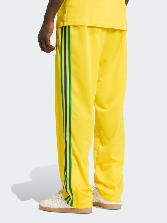 adidas adidas Spodnie dresowe FIREBIRD Żółty Regular Fit