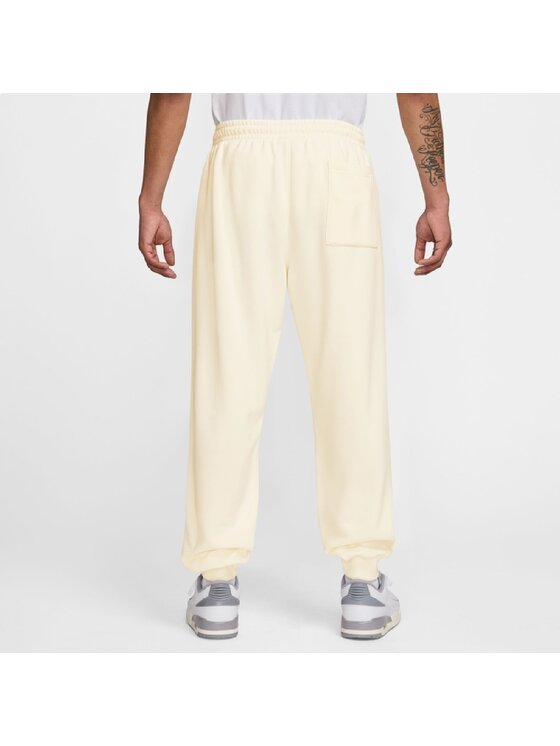 Nike Nike Spodnie dresowe Brooklyn Fleece Graphic Pants Beżowy Regular Fit