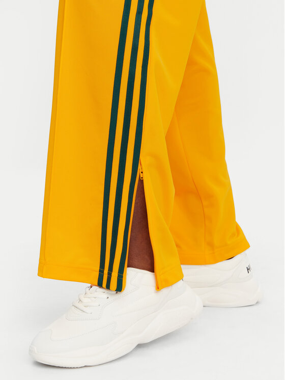 adidas adidas Donji dio trenerke adicolor Classic Firebird JP2316 Žuta Loose Fit