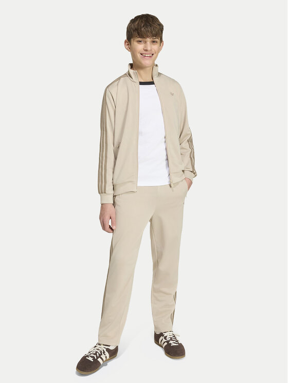 adidas adidas Spodnie dresowe Firebird HZ6652 Beżowy jasny Regular Fit
