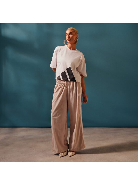 adidas adidas Спортивні штани Essentials 3-Stripes JC8168 Бежевий Loose Fit