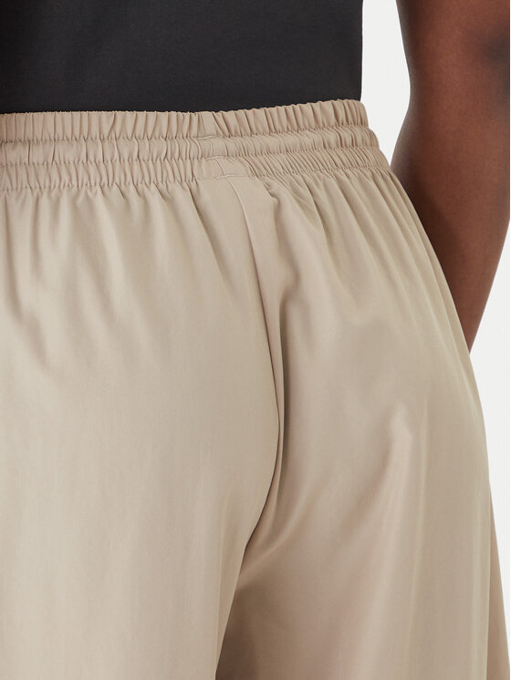 adidas adidas Pantaloni da tuta Firebird Adilenium KD6300 Beige Regular Fit