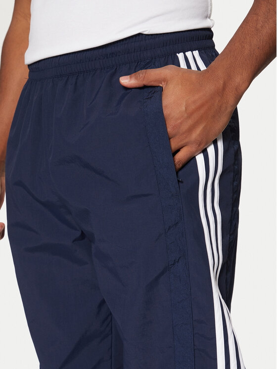 adidas adidas Spodnji del trenirke Adibreak JD4258 Mornarsko modra Loose Fit
