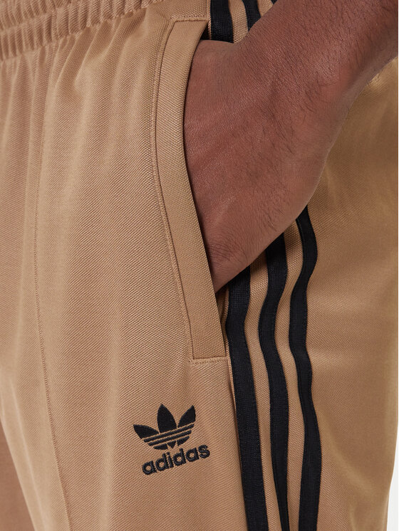 adidas adidas Spodnji del trenirke adicolor Firebird JY1419 Bež Baggy Fit