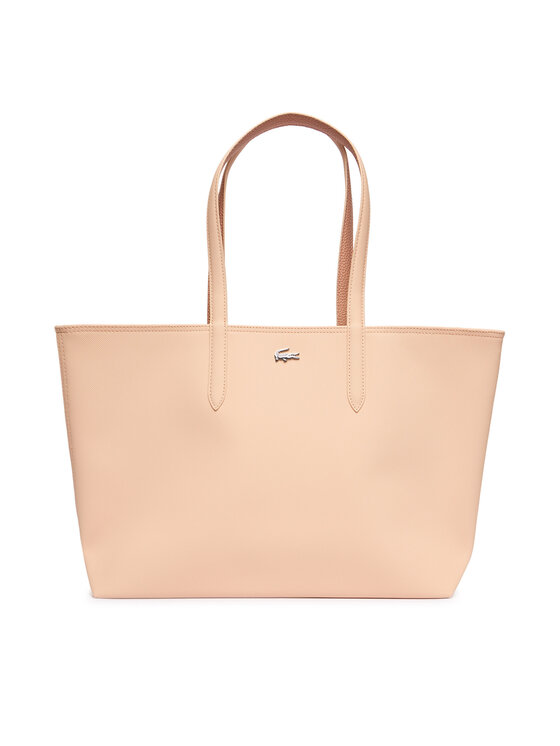 Torebka shopper ustawiona przodem w kadrze, uchwyty wyprostowane ku górze.