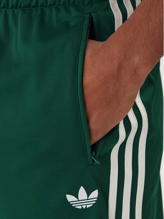 adidas adidas Spodnji del trenirke Firebird KD8317 Zelena Loose Fit