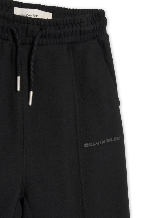 Calvin Klein Jeans Calvin Klein Jeans Spodnji del trenirke Pintuck IB0IB02605 Črna Relaxed Fit