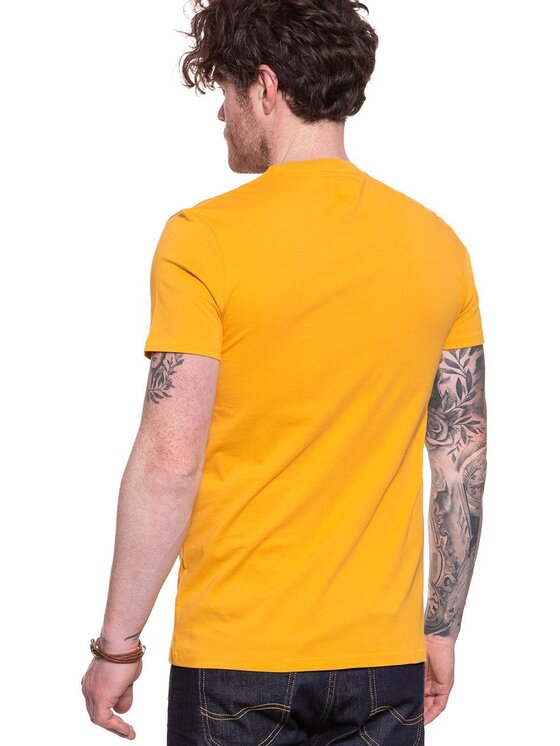 Wrangler Wrangler T-Shirt CIRCLE TEE Żółty Regular Fit