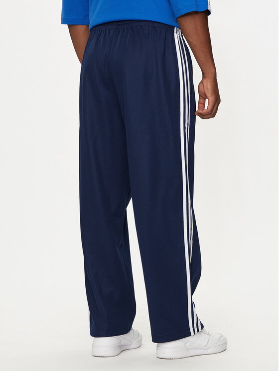 adidas adidas Melegítő alsó adicolor Firebird IZ2466 Sötétkék Baggy Fit