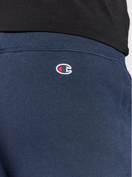 Champion Pantaloni da tuta Blend Vertical Script Logo 216472 Blu scuro  Regular Fit • Modivo.it