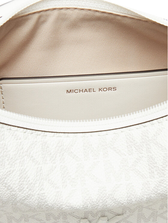 Wnętrze torebki z widoczną podszewką i wszytą kieszenią.