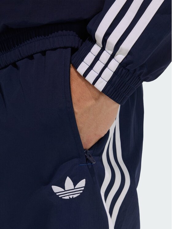 adidas adidas Долнище анцуг FIREBIRD WOVEN Светлосиньо Regular Fit
