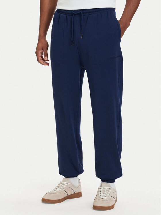 Tommy Hilfiger Pantaloni trening Essential UM0UM03911 Bleumarin Relaxed Fit