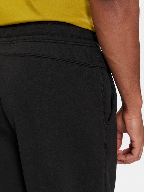 Calvin Klein Calvin Klein Donji dio trenerke Grid Logo K10K112430 Crna Relaxed Fit