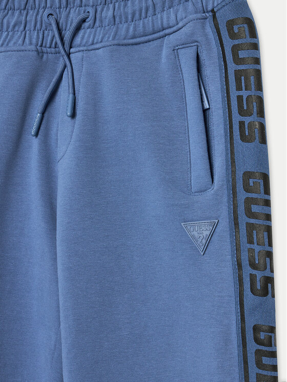 Guess Guess Spodnie dresowe L2YQ48 K6ZS1 Niebieski Relaxed Fit
