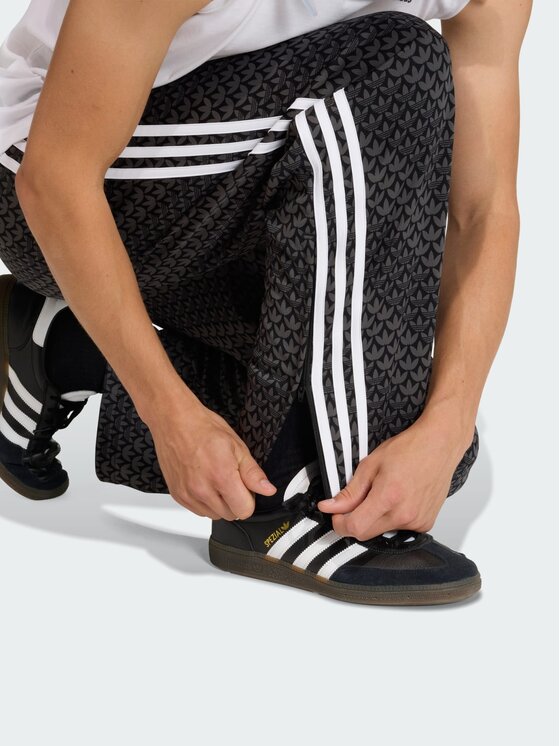 adidas adidas Spodnie dresowe Firebird loose monogram Czarny Regular Fit