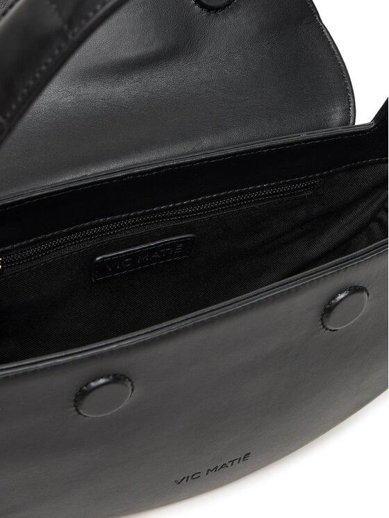Wnętrze torebki z widoczną komorą główną i zamkiem u góry.