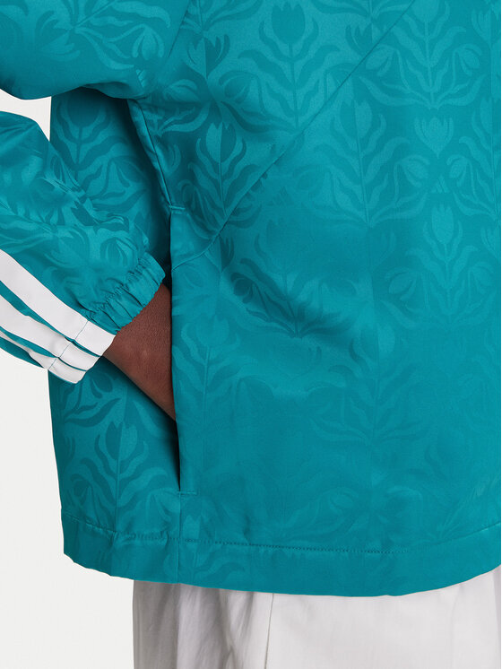 adidas adidas Übergangsjacke Tiro x Common Goal Coaches JL9204 Türkisfarben Loose Fit