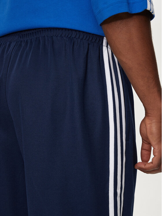 adidas adidas Donji dio trenerke adicolor Firebird IZ2466 Tamnoplava Baggy Fit