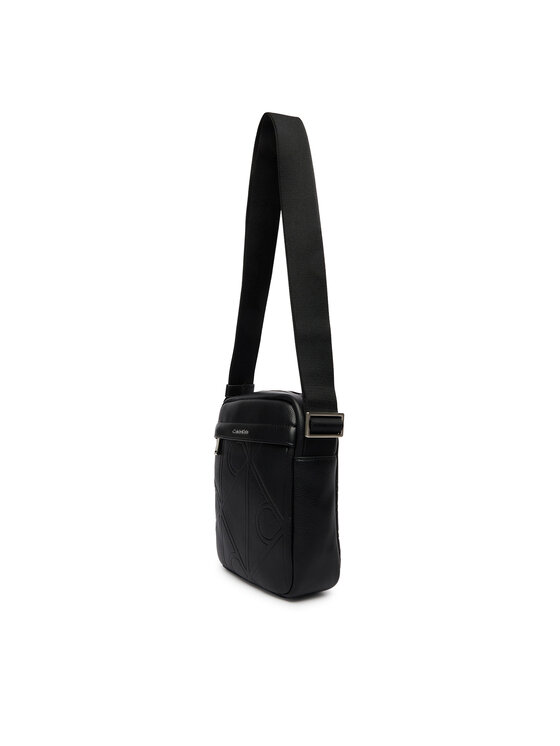 Calvin Klein Calvin Klein Somiņa Emblem Aop Emboss Reporter LV04D3331G Melns