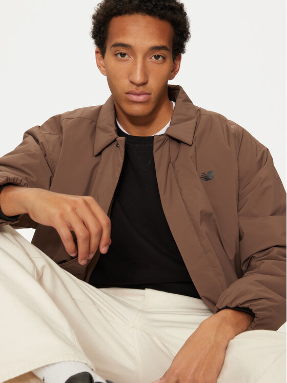 New Balance New Balance Prehodna jakna MJ43504 Rjava Regular Fit