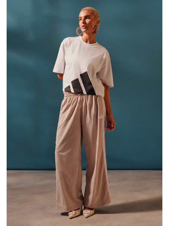 adidas adidas Παντελόνι φόρμας Essentials 3-Stripes JC8168 Μπεζ Loose Fit