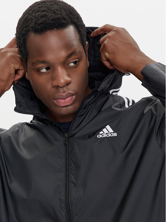 adidas Geacă de vânt Essentials 3-Stripes IB0381 Negru Regular Fit
