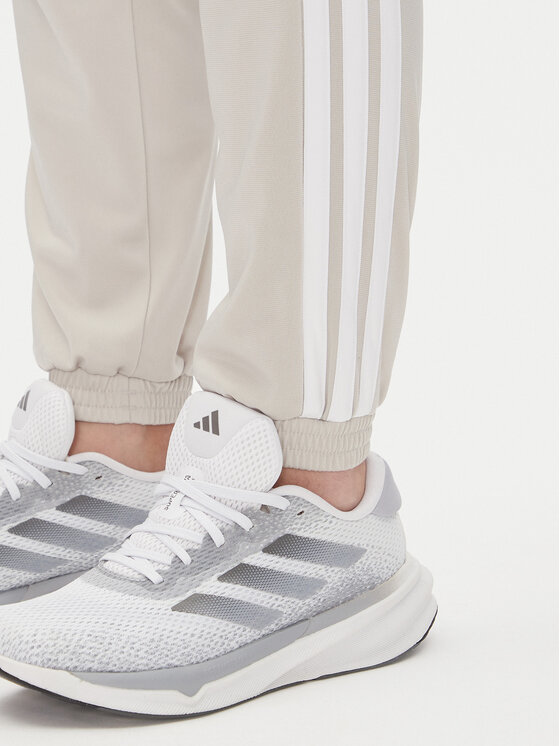 adidas adidas Dressipüksid Tricot 3-Stripes JD4536 Beež Regular Fit
