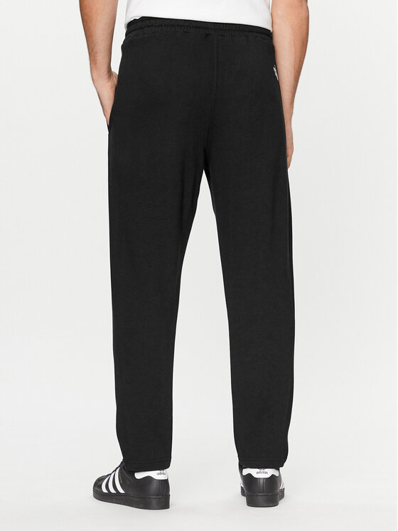 The North Face The North Face Pantaloni da tuta Standard NF0A4M7L Nero Regular Fit