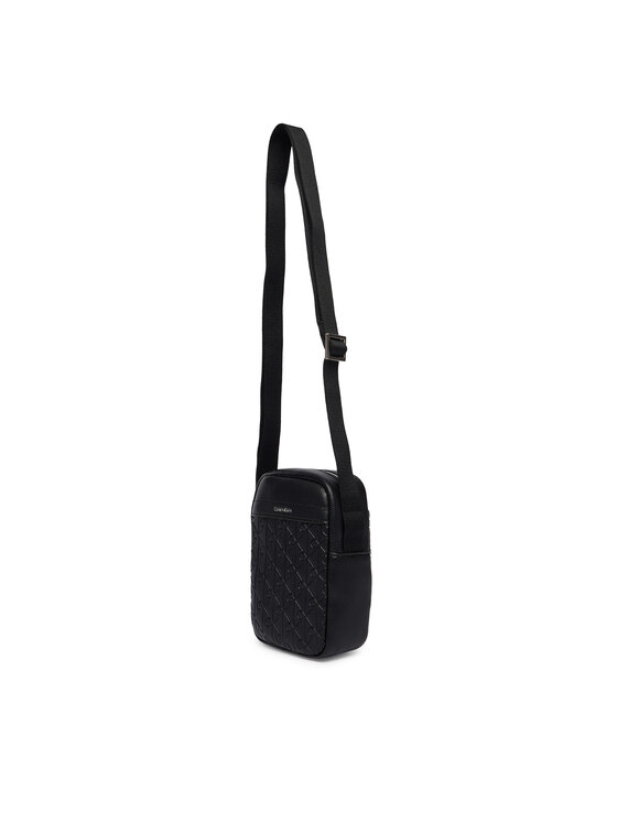 Calvin Klein Calvin Klein Taška cez rameno Emblem Aop Emboss Slim Reporter LV04D3228G Čierna