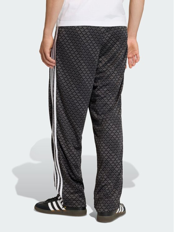 adidas adidas Spodnie dresowe Firebird loose monogram Czarny Regular Fit