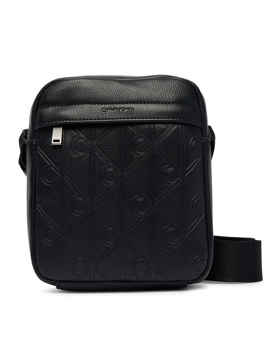 Calvin Klein Calvin Klein Taška cez rameno Emblem Aop Deboss Reporter LV04D3562G Čierna