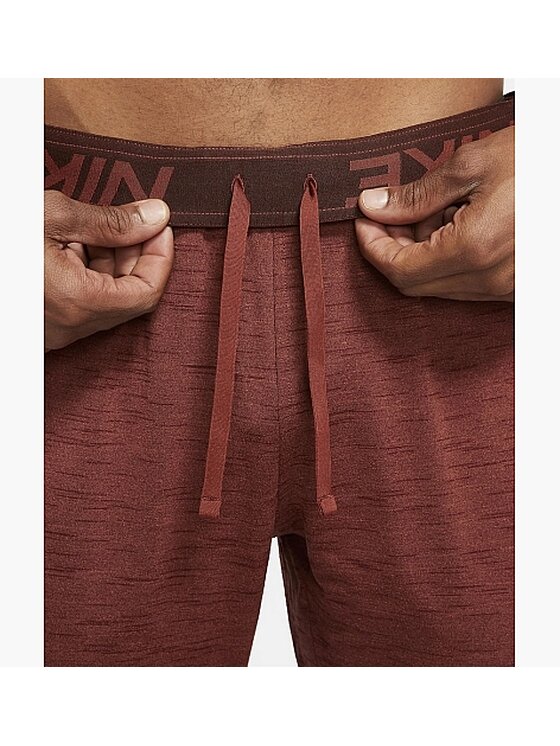 Nike Nike Spodnie dresowe YOGA DRI-FIT PANT Czerwony Regular Fit