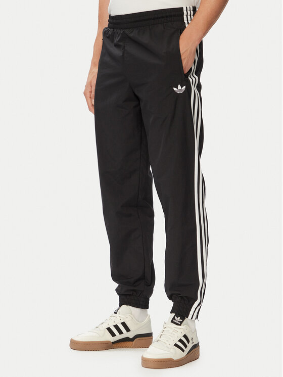 adidas Pantaloni trening Firebird Woven KE1371 Negru Regular Fit