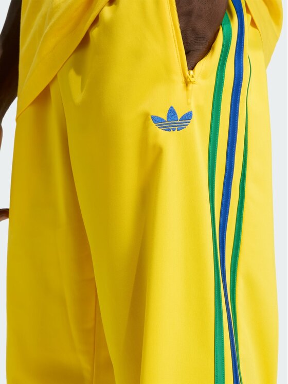 adidas adidas Spodnie dresowe FIREBIRD Żółty Regular Fit