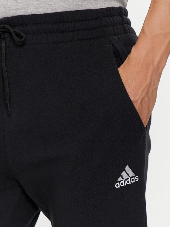 adidas adidas Sporta bikses Essentials French Terry Tapered Cuff Logo Joggers IC0063 Melns Regular Fit