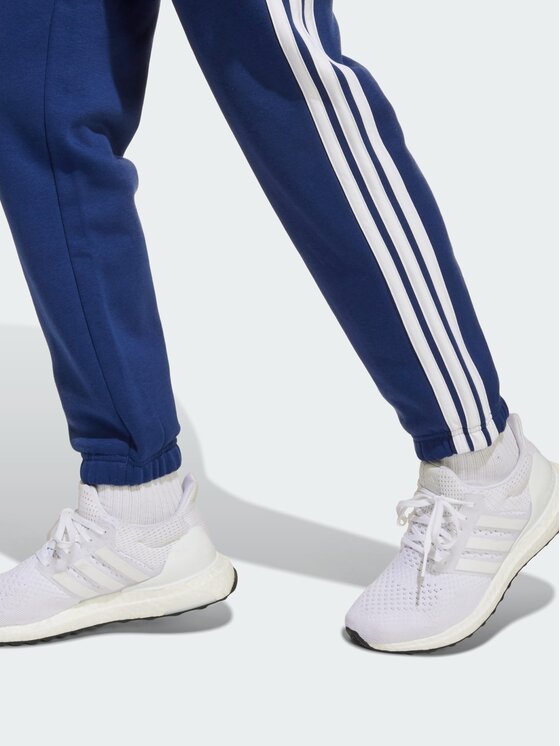 adidas adidas Spodnie materiałowe 141033 Niebieski jasny Regular Fit