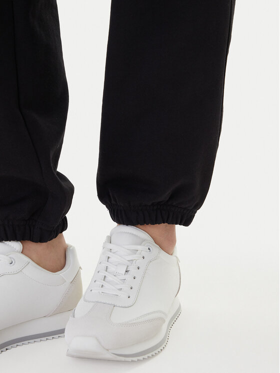 Calvin Klein Jeans Calvin Klein Jeans Долнище анцуг Foil Monologo LV047E826G Черен Regular Fit