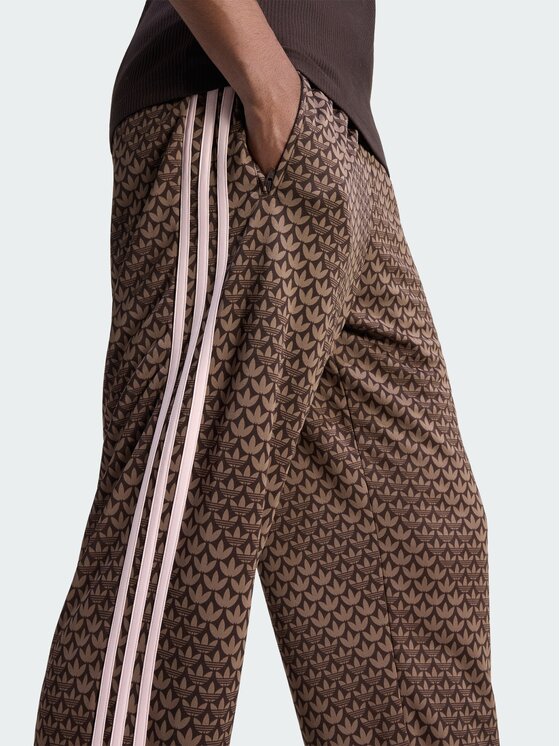 adidas adidas Spodnie dresowe Firebird loose monogram Brązowy ciemny Regular Fit