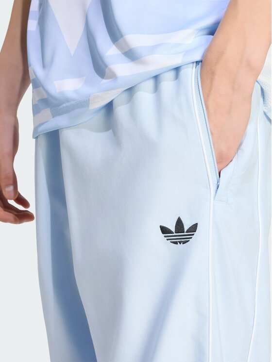 adidas adidas Spodnie dresowe HALF STRIPES Niebieski jasny Regular Fit