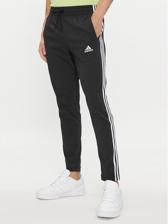 adidas Sporta bikses Essentials Single Jersey Tapered Open Hem 3-Stripes Joggers IC0044 Melns Regular Fit