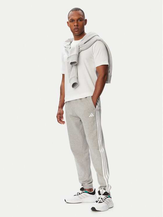 adidas adidas Долнище анцуг Essentials 3-Stripes KY4195 Светлосив Regular Fit