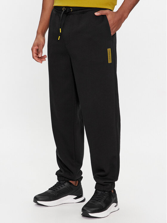 Calvin Klein Teplákové nohavice Grid Logo K10K112430 Čierna Relaxed Fit