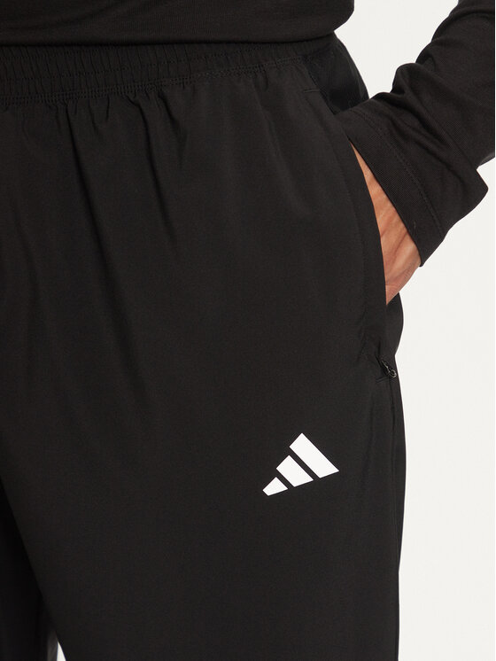 adidas adidas Donji dio trenerke Own The Run IK5024 Crna Regular Fit