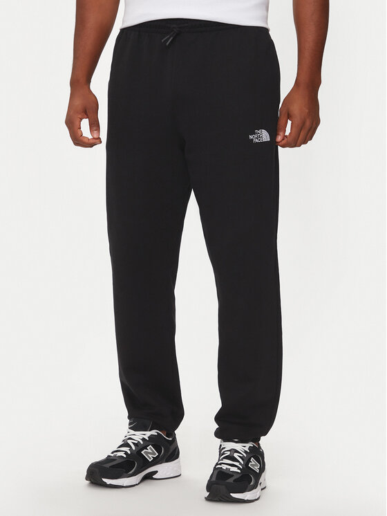 The North Face The North Face Spodnji del trenirke Essential NF0A8A6J Črna Relaxed Fit