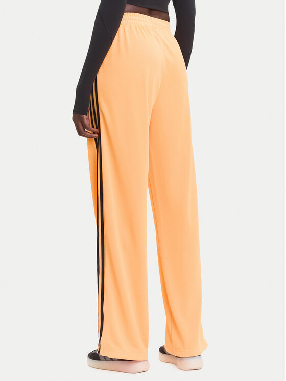 adidas adidas Долнище анцуг adicolor Classic Firebird JY2694 Жълт Loose Fit