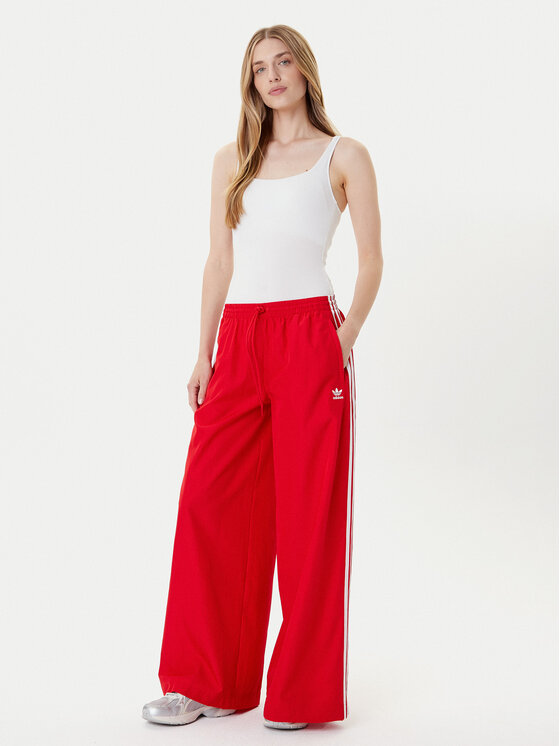 adidas adidas Долнище анцуг adicolor Firebird JD3388 Червен Loose Fit
