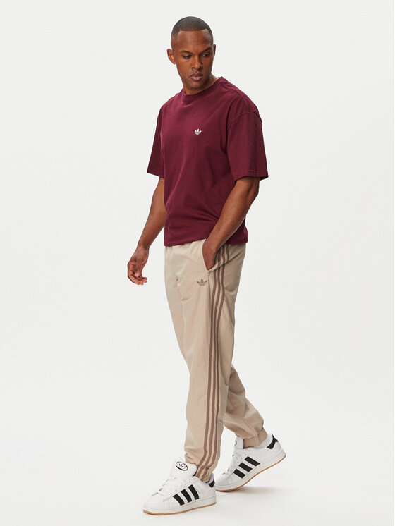 adidas adidas Pantaloni da tuta Firebird KS7503 Beige Regular Fit