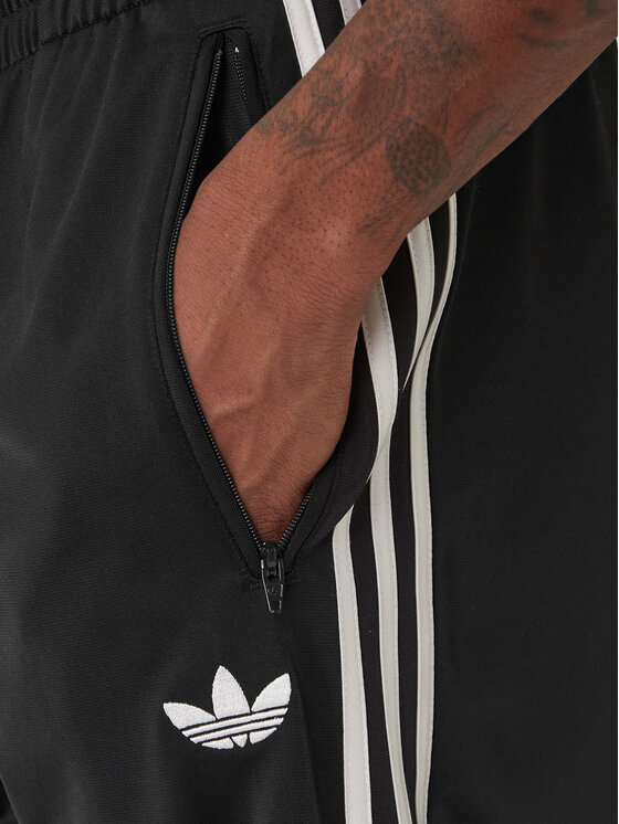 adidas adidas Παντελόνι φόρμας Firebird KD8315 Μαύρο Loose Fit