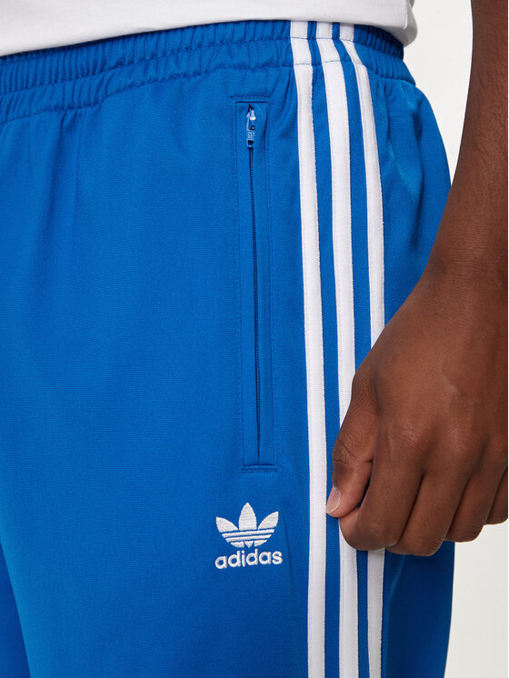 adidas adidas Спортивні штани adicolor Classics Firebird IJ7056 Голубий Regular Fit